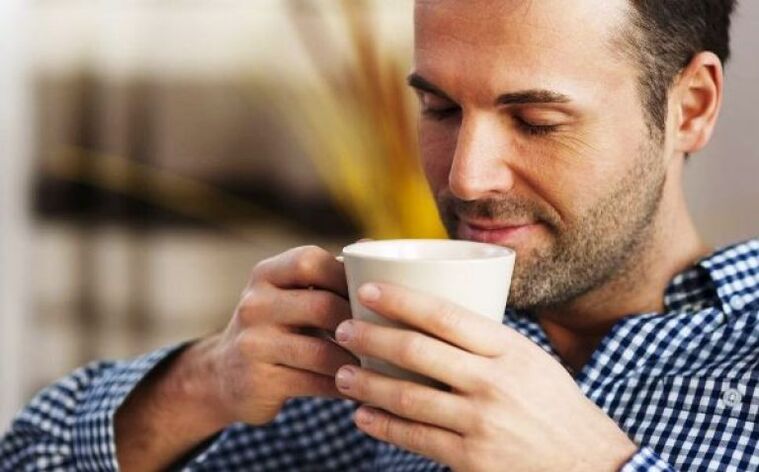 A man drinks a tea drink from a hearth to increase potency